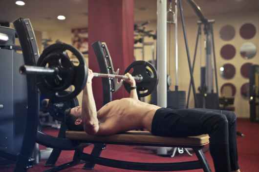 man doing bench press